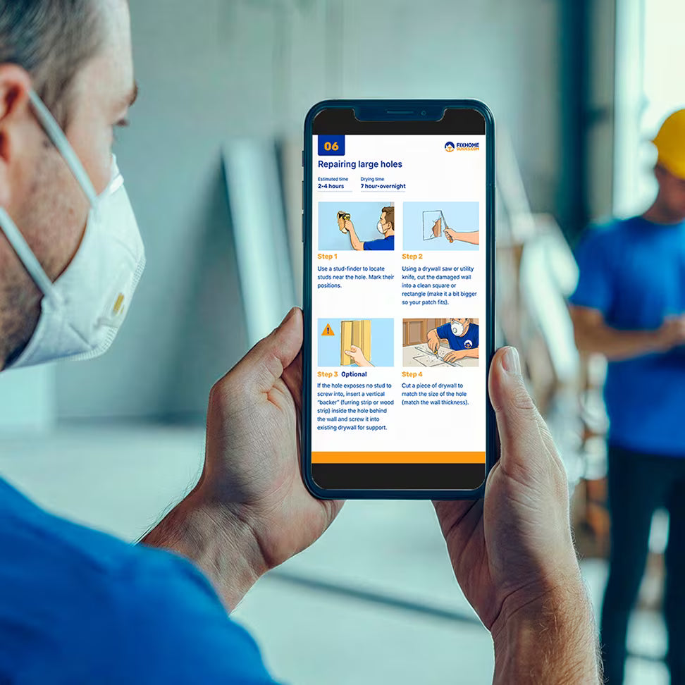 man holding iphone with Drywall repair guide on the phone